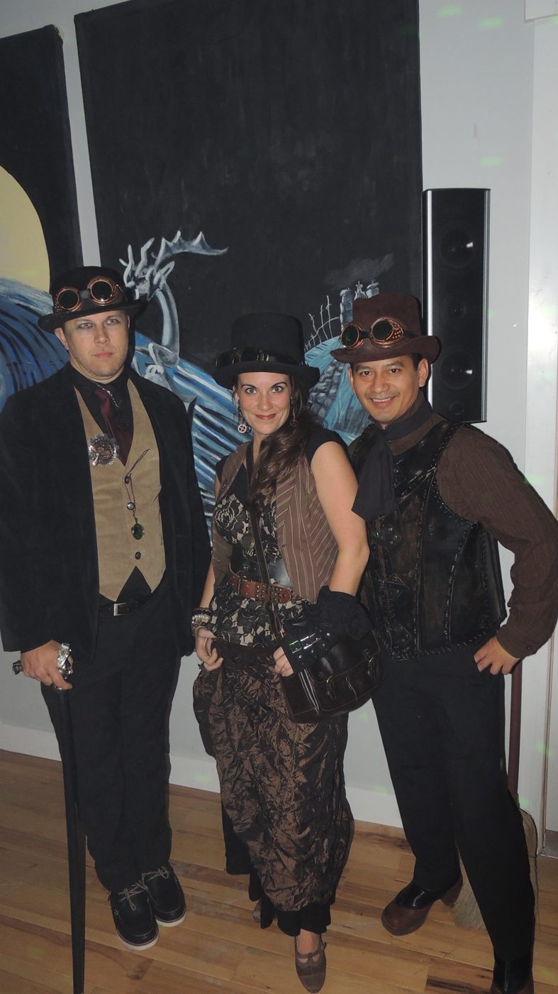 Party guests in steampunk costume